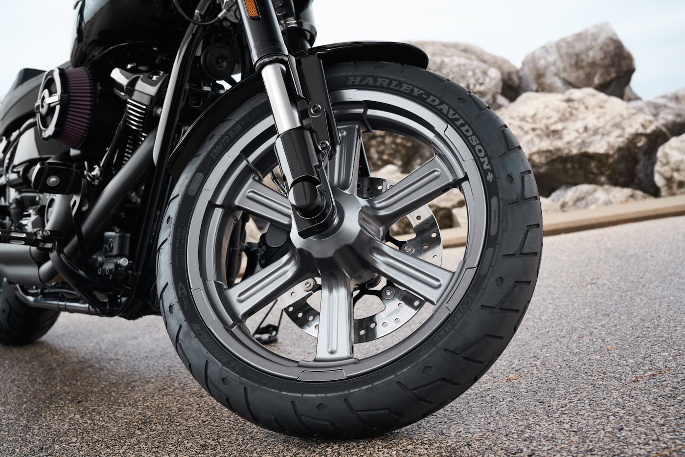 Black motorcycle against moody dark sky